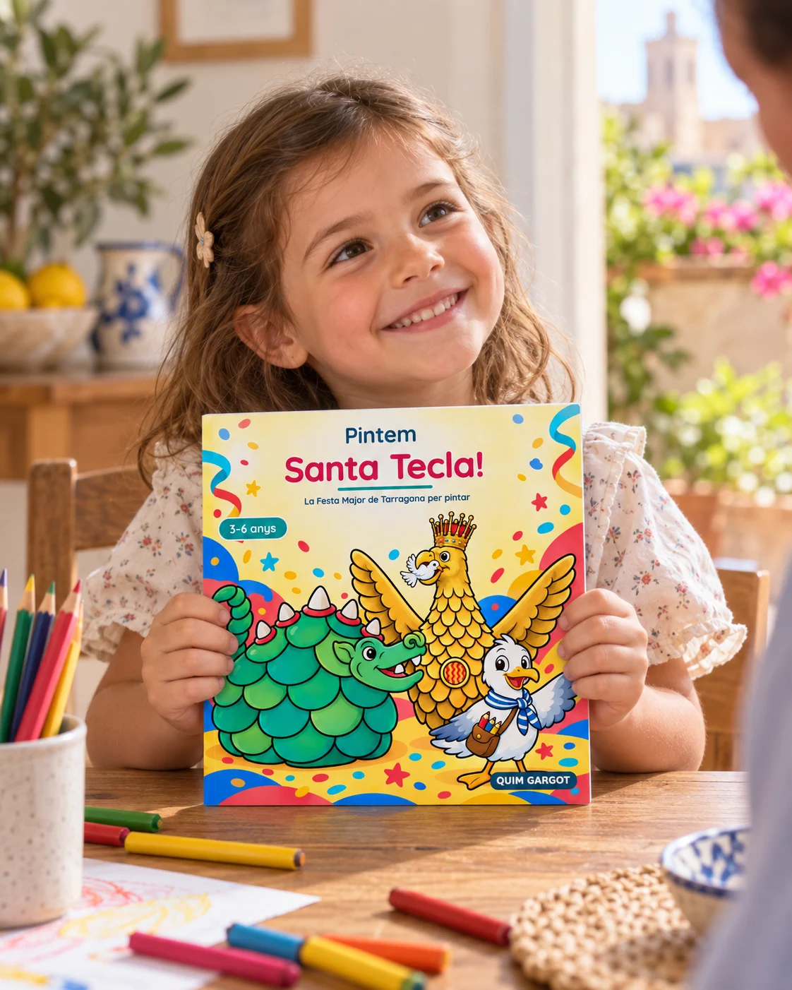 Escena il·lustrativa d’una nena amb la portada de l’edició de 3 a 6 anys